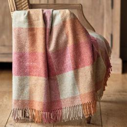 checked wool throw in shades of orange and pink 