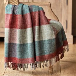 checked wool throw in a palette of deep red and blue with a fringe edge