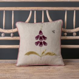square linen cushion appliquéd with a single stem purple foxglove and embroidered bee detail. 
