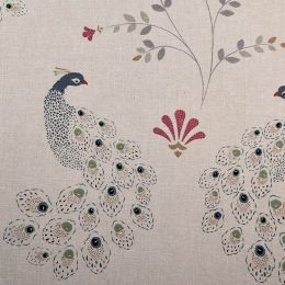 linen fabric printed with an intricate peacock design in shades of blue, green, gold and pink