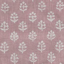 mauve linen fabric printed all over with a floral block print design