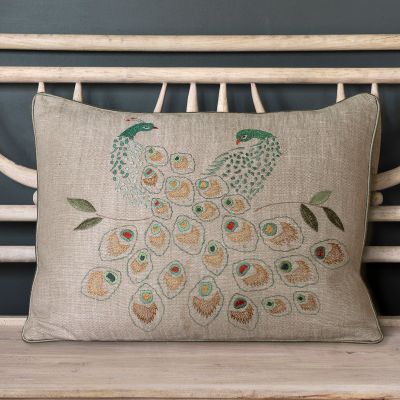 linen cushion intricately embroidered with two peacocks in shades of blue, green and gold, 