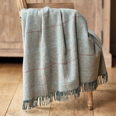light blue tartan wool throw with stripes of red, ivory and pale blue 