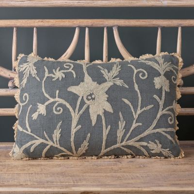 charcoal cushion with delicate ivory crewelwork detail 