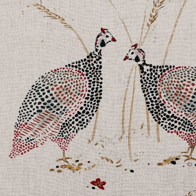 linen fabric printed with an intricate design of two guinea fowl in charcoals, reds and gold