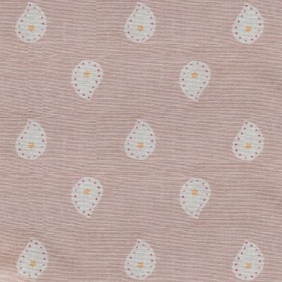 Dusky pink cotton fabric printed with a yellow and white paisley inspired design