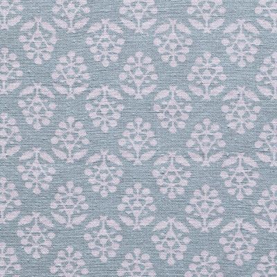 blue cotton fabric printed all over with a white floral sprig design 