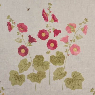 linen fabric printed with intricate hollyhock flowers in pinks and greens